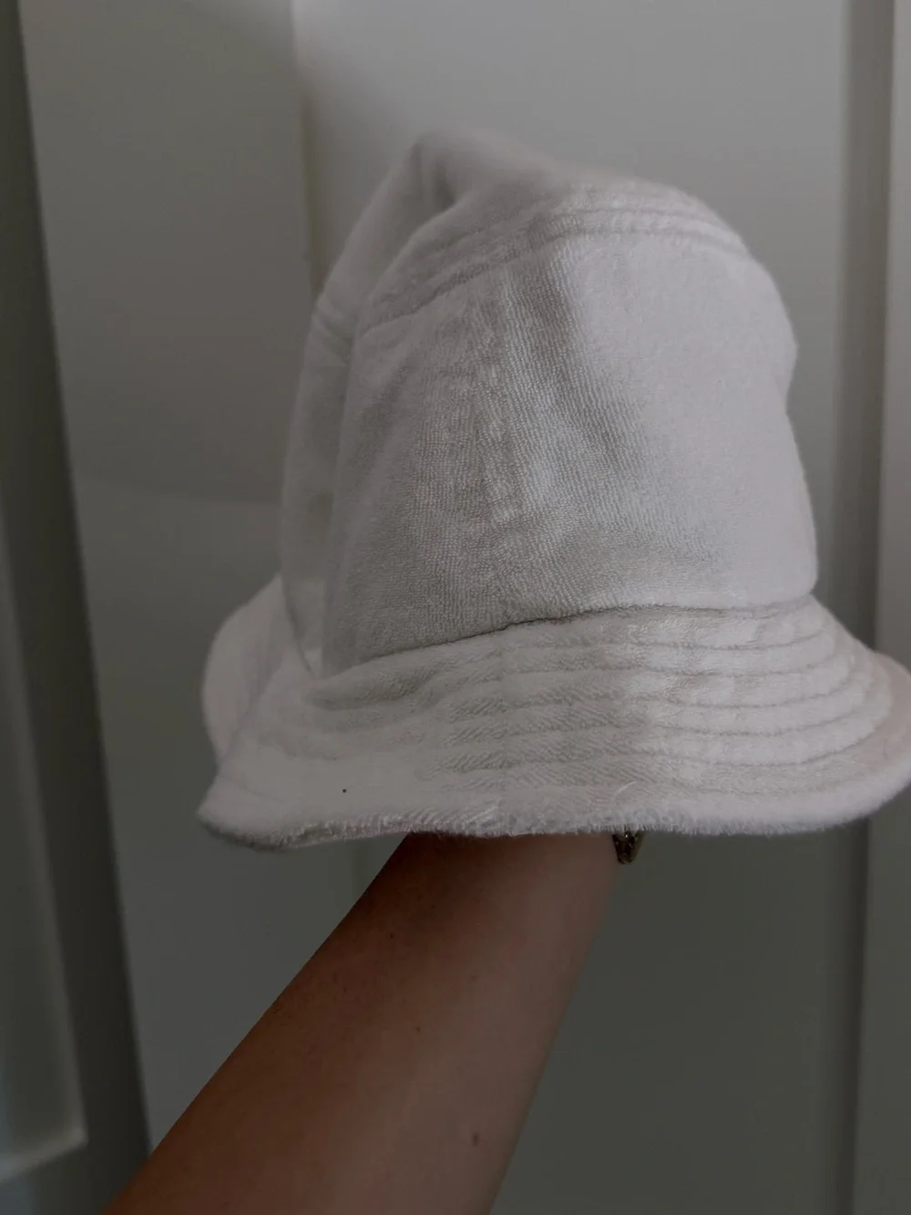 The Enchanté Cafe bucket hat in white terry cloth